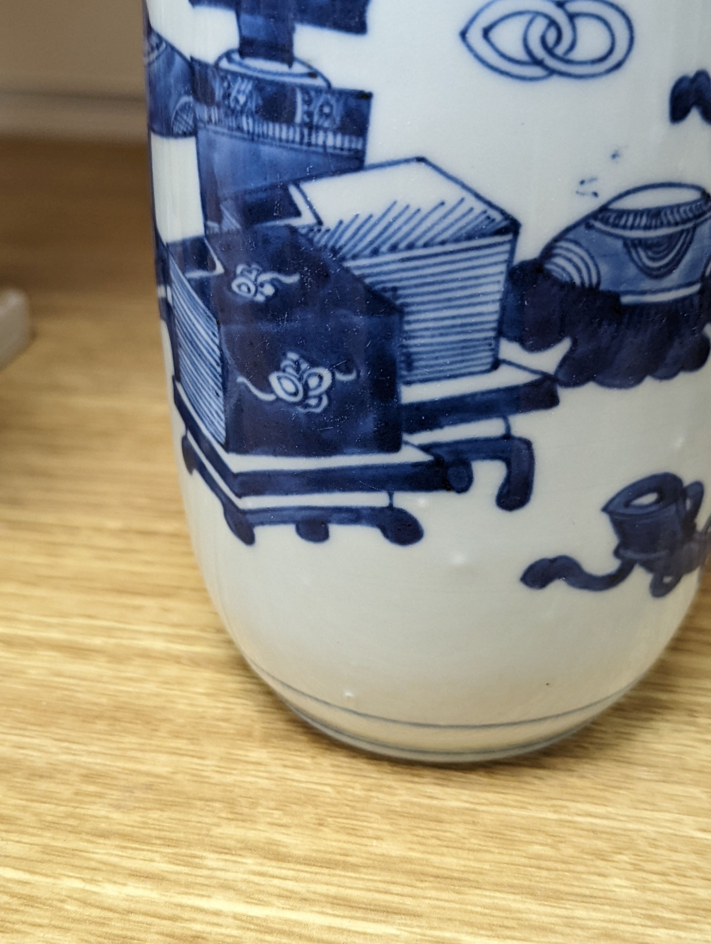 A Chinese blue and white ‘Antiques’ vase, 19.5 cms high.